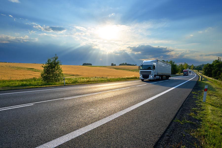 Inland Marine Insurance - Truck Moving Along the Road Transporting Goods