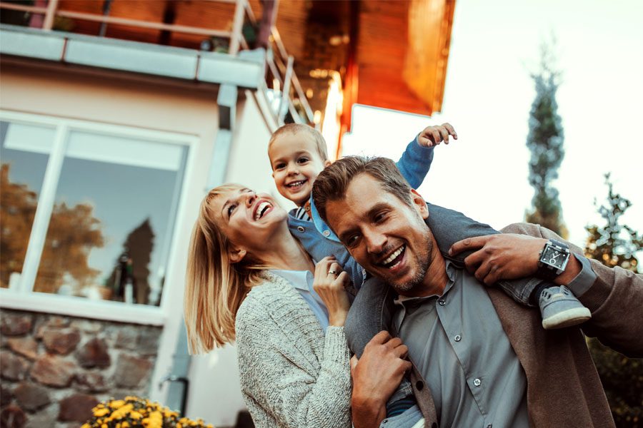 Umbrella Insurance - Family Having Fun Outside of Their Home