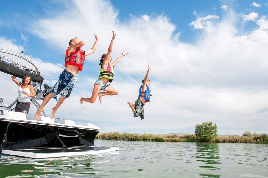 Boat Insurance - Family Jumping Off Boat in the Lake