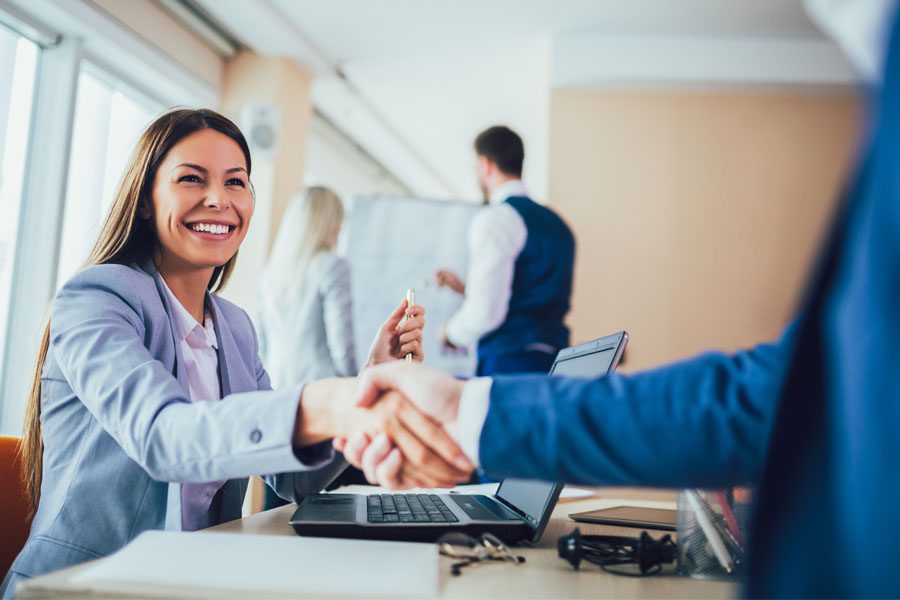 Referrals for Charity - Handshake Over a Business Meeting in an Office